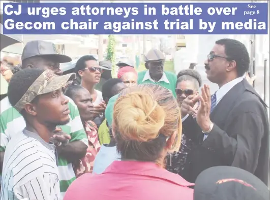  ??  ?? Attorney General Basil Williams (right) addressing supporters after calming them outside of the High Court.