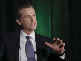  ??  ?? California gubernator­ial candidate Lt. Gov. Gavin Newsom, a Democrat, discusses the state’s housing problems at a conference on Thursday, in Sacramento. Newsom and five other leading candidates to replace Gov. Jerry Brown in this years’ election...