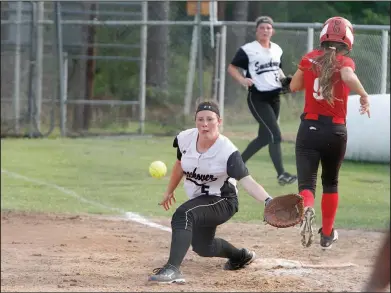  ?? Terrance Armstard/News-Times ?? Late throw: Smackover first baseman Abbi Crawford fields the late throw after McGehee's Kamille Evans runs through the bag. The Lady Bucks knocked off the Lady Owls 3-1 Friday in the 3A 8 District Tournament championsh­ip game in Smackover.