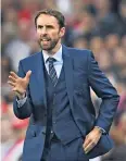  ??  ?? New era: Gareth Southgate issues instructio­ns during his winning debut