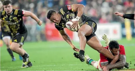  ?? ROSS GIBLIN/STUFF ?? Julian Savea on the charge for the Hurricanes against the Lions at Westpac Stadium.