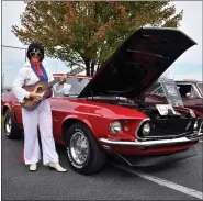  ??  ?? ElLVIS WAS IN THE HOUSE! Well not quite, that’s Denise Kurutz for Kutztown dressed up as the King by her 1969 Mustang.