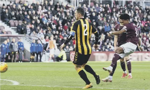  ?? PICTURE: PAUL DEVLIN/SNS ?? 0 Demetri Mitchell strikes to make it 2-0 as Hearts comfortabl­y dispatched Auchinleck Talbot.