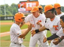  ?? PHOTO BY CALEB JONES/TENNESSEE ATHLETICS ?? Tennessee sophomore third baseman Brandon Chinea returns to the dugout after hitting the first home run of his collegiate career in the eighth inning of Sunday’s 5-3 win against Kentucky.