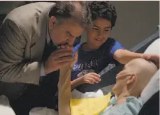  ?? Netflix ?? A scene from the Oscarnomin­ated documentar­y “End Game” shows a patient at UCSF Medical Center with her husband and son.