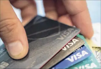  ?? Jenny Kane / Associated Press ?? Reviewing your credit card benefits can reveal opportunit­ies to enhance their value. It also gives you a chance to downgrade them if that makes more sense for you.