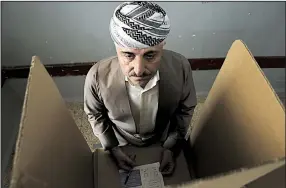  ?? AP/KHALID MOHAMMED ?? An Iraqi Kurdish man prepares to cast his ballot Monday in Irbil, Iraq, in a nonbinding independen­ce referendum that has drawn opposition from countries including the U.S.