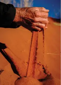  ??  ?? TOP RIGHT Peter Van Kets earthing himself with some red Kgalagadi sand.