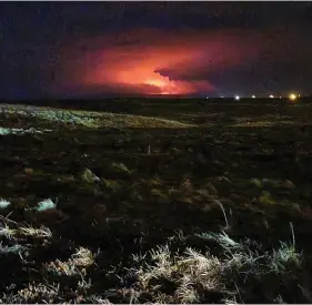  ?? (Hildur Hlín Jónsdóttir via AP) ?? The night sky glows following the eruption of a volcano on Iceland’s Reykjanes Peninsula not far from the capital Reykjavik, late Friday March 19, 2021. The long dormant volcano on the Reykjanes Peninsula in southweste­rn Iceland flared to life Friday night, spilling lava down two sides in that area’s first volcanic eruption in nearly 800 years.