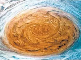  ?? NASA ?? NASA’s Juno captured this photo, among others posted online, as it passed 5,600 miles above Jupiter’s iconic Great Red Spot, a 10,000-mile-wide storm.