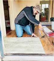  ??  ?? Julian Killiard
LEFT: Tariq Sattar, board chairman of the Council on American-Islamic Relations-Oklahoma chapter, installs flooring in a home as part of the as part of the Interfaith Alliance’s Many Belief’s Serving Together Rebuilding Together crew.