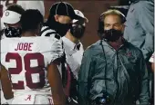  ?? ROGELIO V. SOLIS — THE ASSOCIATED PRESS ?? Alabama coach Nick Saban, right, has tested positive for COVID-19 but has no symptoms.