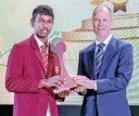  ?? ?? First place winner, Abiru Sujayana, accepts his award from chief guest UNICEF Sri Lanka Representa­tive Christian Skoog