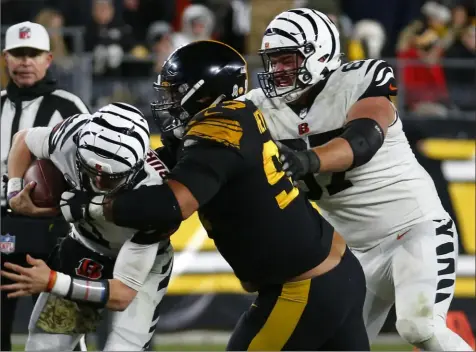  ?? Justin K. Aller/Getty Images ?? The Steelers’ Cam Heyward sacks Bengals quarterbac­k Joe Burrow during the third quarter Sunday at Acrisure Stadium.