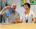  ?? CATHERINE GROENESTEI­N/STUFF ?? South Taranaki District Council communicat­ions manager Gerard Langford and community and infrastruc­ture services manager Fiona Greenhill sample water from one of the jugs being provided to Eltham residents.