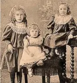  ??  ?? Dressed: Henry Zacharias (centre) with his sisters Olive and Mabel