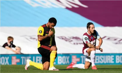  ??  ?? Troy Deeney takes a knee in support of the Black Lives Matter movement before Watford’s match at Burnley. Photograph: Getty Images