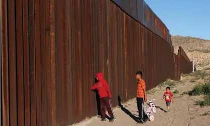  ??  ?? Kids from Anapra, a neighbourh­ood on the outskirts of Ciudad Juarez in Mexico, are seen by the border fence in February. Photograph: Hérika Martínez/AFP/Getty Images