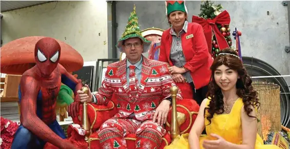  ?? PHOTO: BEV LACEY ?? FESTIVE CHEER: Ready for Christmas in the CBD are (from left) Michael Talbot as Spiderman, Cr Geoff McDonald, Cr Anne Glasheem and Amy Knie as Belle from Beauty and the Beast.