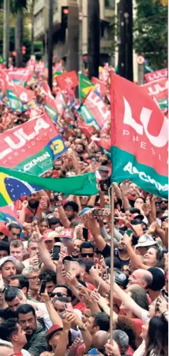  ?? ?? LUIZ INACIO LULA DA SILVA (right), presidenti­al candidate of the Workers’ Party, greets supporters during a campaign rally in Brazil’s Belo Horizonte, on October 9. Most election observers are confident that Lula will emerge a winner.