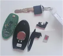  ??  LORRAINE SOMMERFELD/DRIVING ?? This what remains of a key fob to the Infiniti Q70 after a snow plow ran over it.