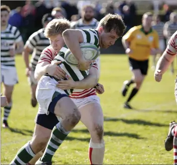  ??  ?? Con Callan of Greystones is tackled by Clayton Stewart of Nenagh Ormond.