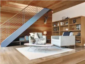  ??  ?? A reading nook is beneath the staircase of the Berkeley home in the master suite's sitting area.