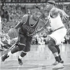  ?? ADAM GLANZMAN/GETTY IMAGES ?? Kyrie Irving (2) of the Cavaliers drives to the basket against the Celtics’ Isaiah Thomas.