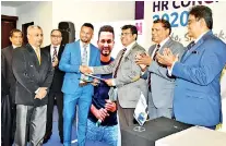  ??  ?? CIPM President Dhammika Fernando and officials with CIPM Brand Ambassador and Sri Lanka Cricket Captain Dimuth Karunaratn­e