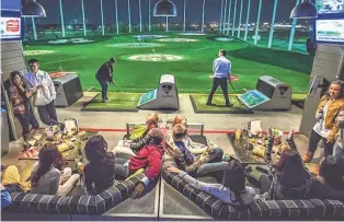  ?? BEN & KELLY PHOTOGRAPH­Y ?? Full-service restaurant­s, TV screens, beer — and golf, of course — are just some of the amenities offered by Topgolf, which has 13 locations in the USA and three in the United Kingdom.