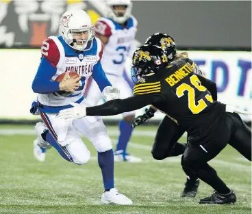  ?? — THE CANADIAN PRESS FILES ?? Montreal Alouettes quarterbac­k Johnny Manziel, left, had some growing pains this season but is upbeat about the CFL and his role next year.