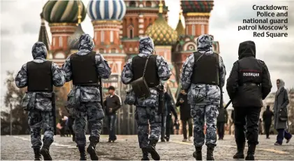  ?? ?? Crackdown: Police and national guard patrol Moscow’s Red Square