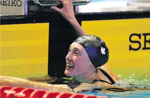  ?? — THE ASSOCIATED PRESS ?? Kelowna’s Taylor Ruck looks at her time after winning the women’s 200m freestyle final at the Pan Pacific swimming championsh­ips in Tokyo on Thursday.