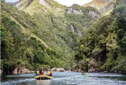  ??  ?? This is the last section of relatively open river country, with calm waters, before rafters need to start negotiatin­g the many rapids and narrow cliff walls of the Great Ravine.