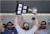  ?? SEAN PROCTOR/STAFF FILE ?? Admirals captain Mike Angelidis lifts the AHL’s Calder Cup over his head in June 2012 at the Scope after a parade.