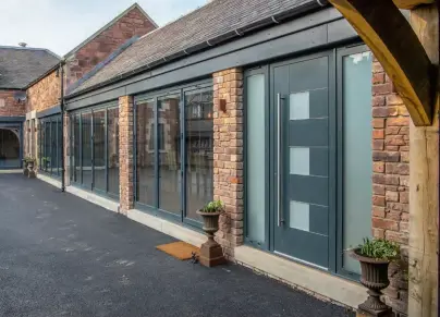  ??  ?? Above: Made from aluminium, the Caverro front door forms a striking modern contrast to the traditiona­l brickwork of this house. Priced from £2,000, this model is from Express Bi-folding Doors