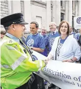  ?? PHOTO: STEVE HUMPHREYS ?? AGSI general secretary Antoinette Cunningham chats with Sgt Neill Crowley as she prepares to lead members of the AGSI in a protest at Government Buildings in 2016.