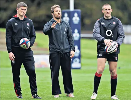  ??  ?? Expert tuition: Jonny Wilkinson (centre) gives Owen Farrell (left) and Mike Brown advice during kicking practice