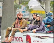  ?? AFP ?? Taliban fighters patrol along a street in Kabul on Sunday amid suicide bomb threats.