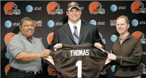  ?? THE ASSOCIATED PRESS FILE ?? Browns first-round draft pick Joe Thomas is flanked by coach Romeo Crennel, and general manager Phil Savage during a news conference on April 29, 2007, in Berea, Ohio.
