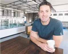  ??  ?? Jamie Whincup the businessma­n at his Hope Island cafe.