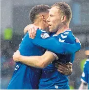  ??  ?? Lion tamer: Scott Arfield, right, celebrates after scoring the winner for Rangers in the 59th minute