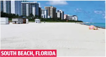  ??  ?? SOUTH BEACH, FLORIDA Last sunbather: Golden sands all but deserted yesterday