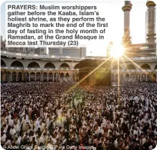  ?? ?? PRAYERS: Muslim worshipper­s gather before the Kaaba, Islam’s holiest shrine, as they perform the Maghrib to mark the end of the first day of fasting in the holy month of Ramadan, at the Grand Mosque in Mecca last Thursday (23)
© Abdel Ghani Bashir/AFP via Getty Images
