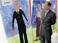  ??  ?? Prince Edward admires a portrait of himself by infant pupils at Cromarty Primary School