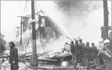  ?? COURTESY OF FIREFIGHTE­RS MUSEUM OF NOVA SCOTIA ?? During a 1963 blaze, the fire destroyed eight businesses in one morning. Some businesses were located where the Brown Street parking lot in Yarmouth is today.