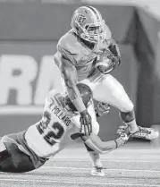  ?? Mark Lambie / El Paso Times ?? Rice cornerback Ryan Pollard stops UTEP’s LaQuintus Dowell during the first half of the Miners’ win Friday night in El Paso.