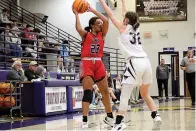  ?? The Sentinel-Record/James Leigh ?? ■ Cutter Morning Star’s Natalie Babb (23) looks to pass over Perryville’s Kate Wood (32) during Tuesday’s loss in the Fountain Lake Christmas Classic.