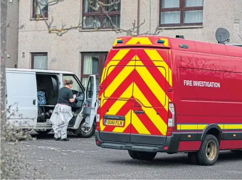  ??  ?? TRAGIC: Teams of investigat­ors spent the day at the flat in Randolph Street, Buckhaven, following the fatal fire.