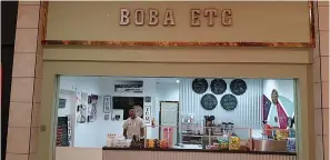  ?? Staff photo by Junius Stone ?? ■ Boba Etc is a family operation. Jairo Solis, one of Demertrice Okafer's sons, is seen running things at their place in Central Mall. Boba Etc specialize­s in bubble tea and rolled ice cream and soon will serve sushi.